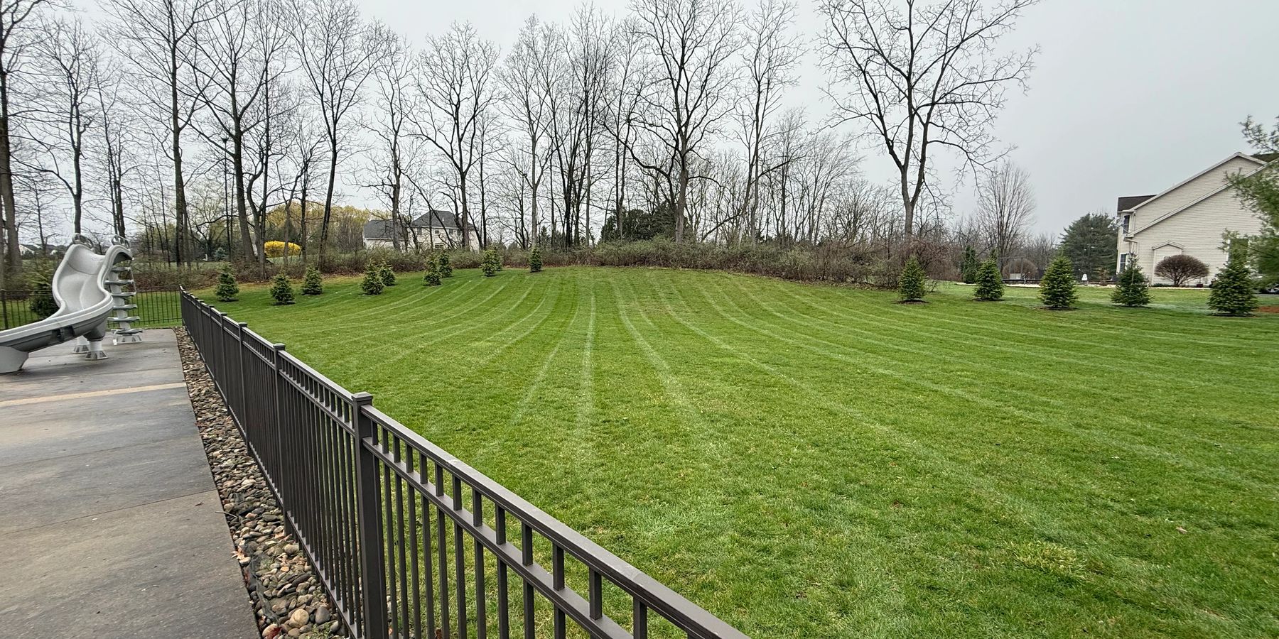 Striped lawn mowed by MB Landscaping